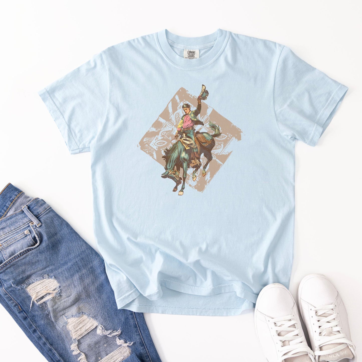 Rodeo spirit vintage bronc laid out with jeans and shoes in color chambray