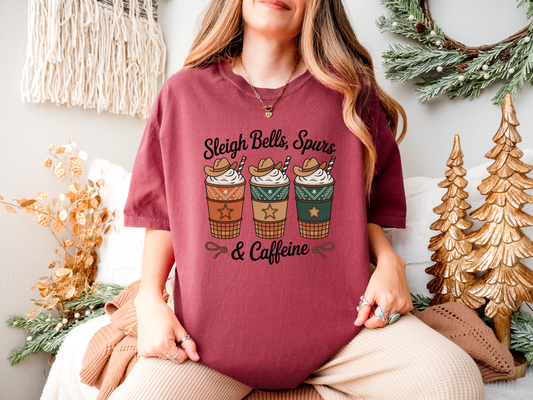 Sleigh Bells Spurs and Caffeine Comfort Colors Western Christmas coffee t-shirt with cowboy hat coffee cups and candy cane straws