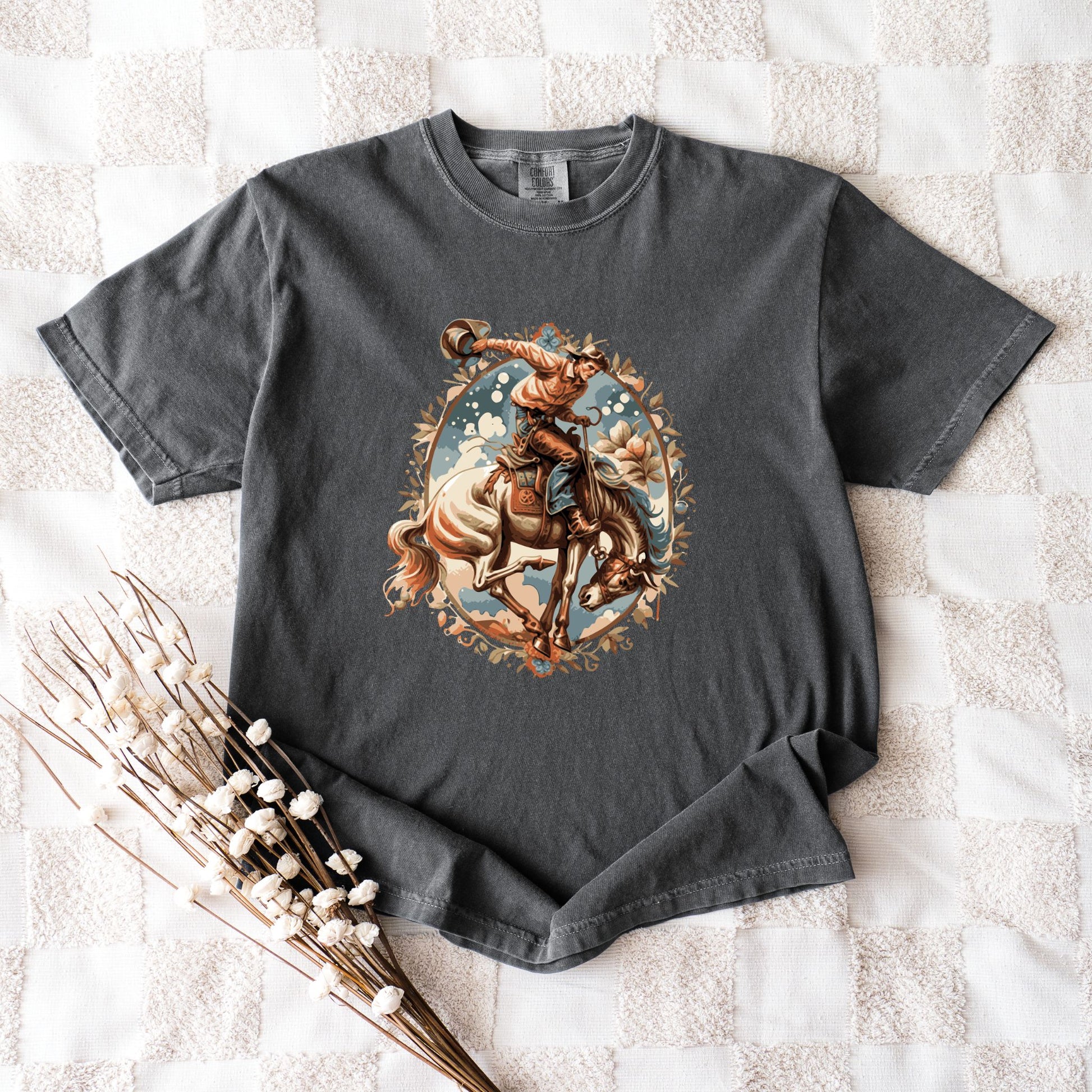 Vintage floral cowgirl tee laid out with props in color pepper