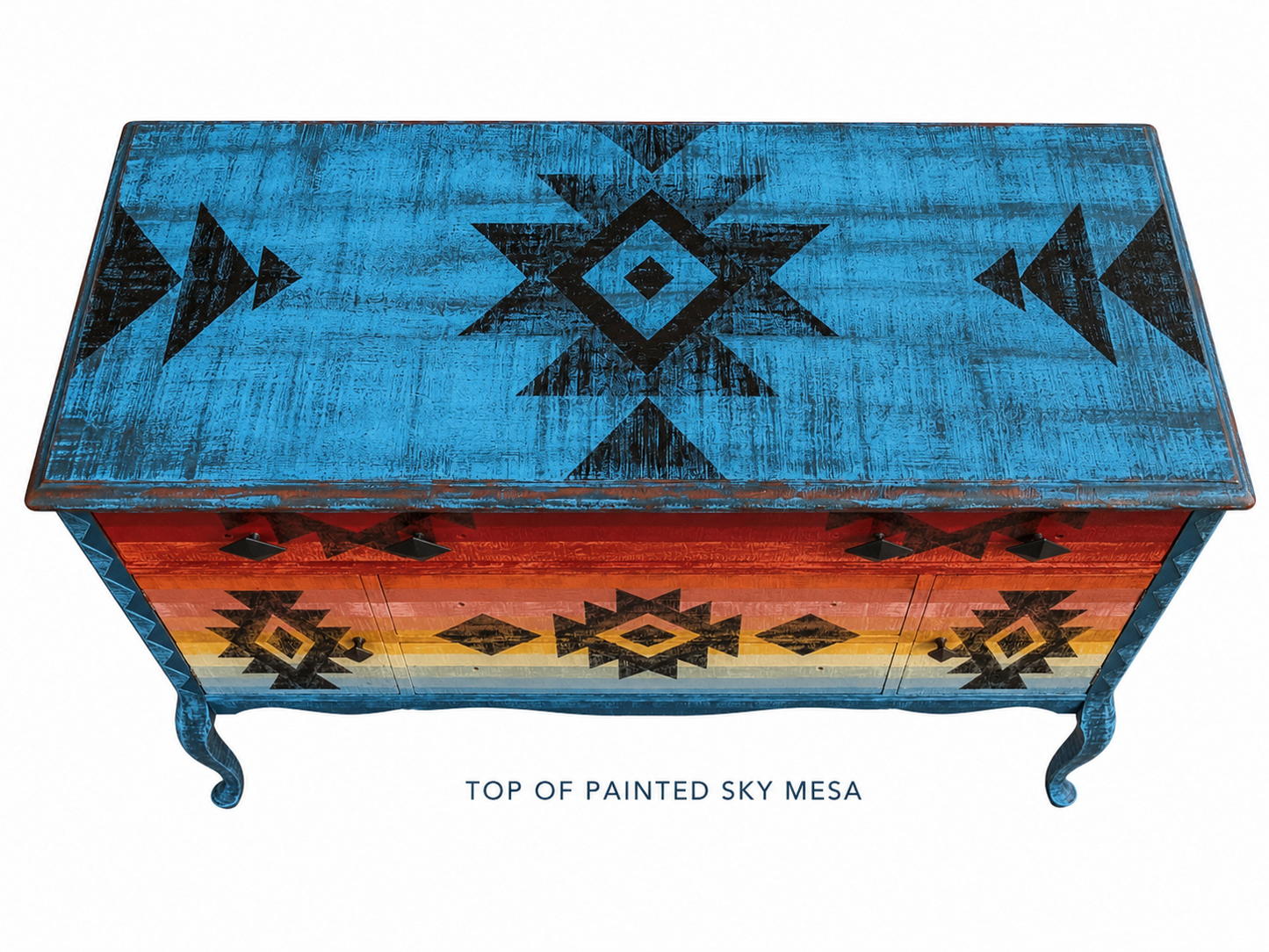 Painted wooden chest with geometric patterns on a white background